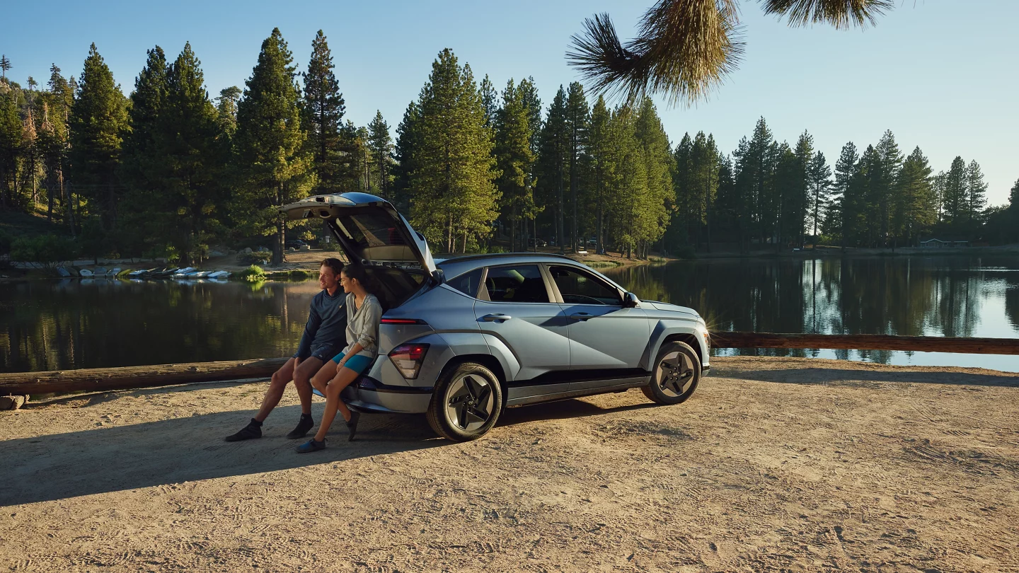 2025 Hyundai KONA Electric with couple by the beach