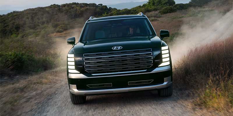 2026 Hyundai Palisade SUV driving on rugged dirt road